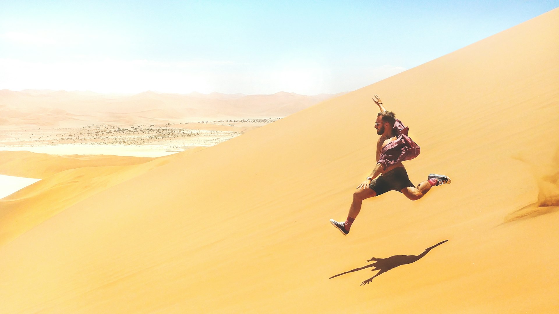 man running down on desert